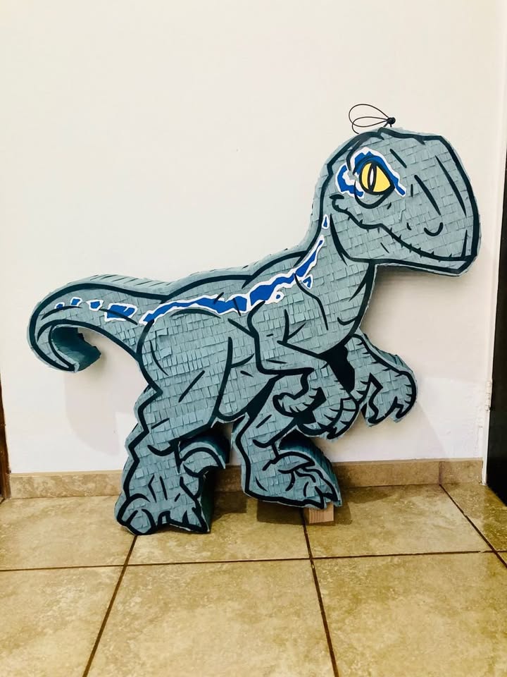 Custom Velociraptor piñata inspired by Jurassic Park perfect for dino parties